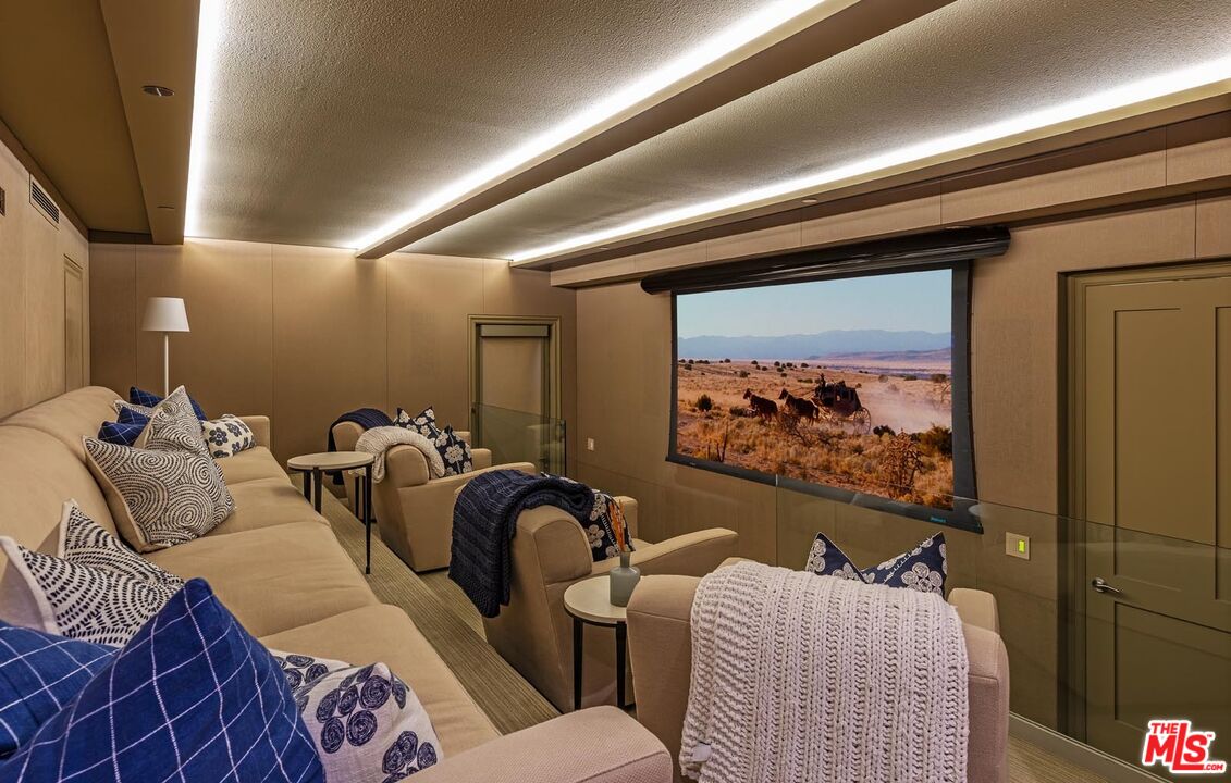 31412 Broad Beach Road Malibu, CA 90265 - Photo 12 of 32 a living room with furniture a rug and wall painting