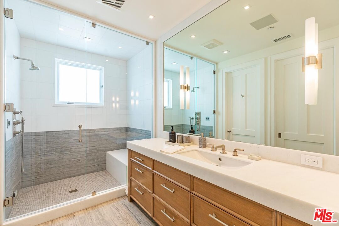 31412 Broad Beach Road Malibu, CA 90265 - Photo 17 of 32 a bathroom with a double vanity sink mirror and shower