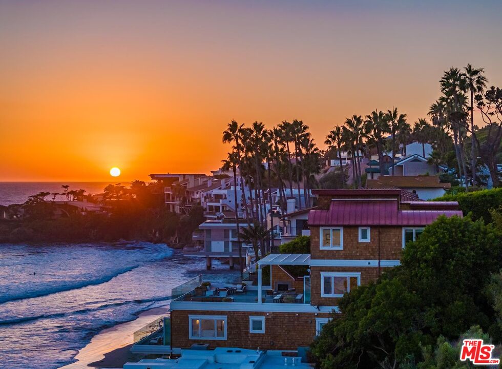 31412 Broad Beach Road Malibu, CA 90265 - Photo 31 of 32 a view of a big building with an outdoor space and seating