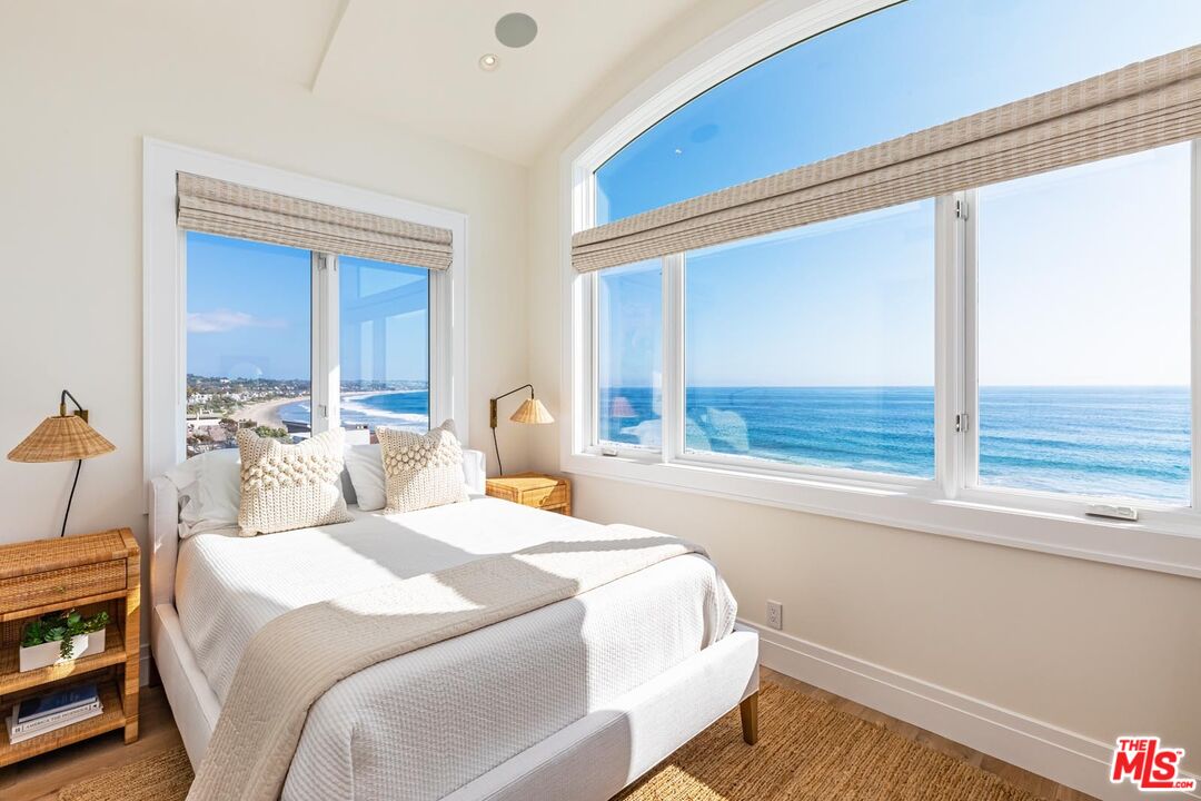 31412 Broad Beach Road Malibu, CA 90265 - Photo 5 of 32 a bedroom with a bed and a large window