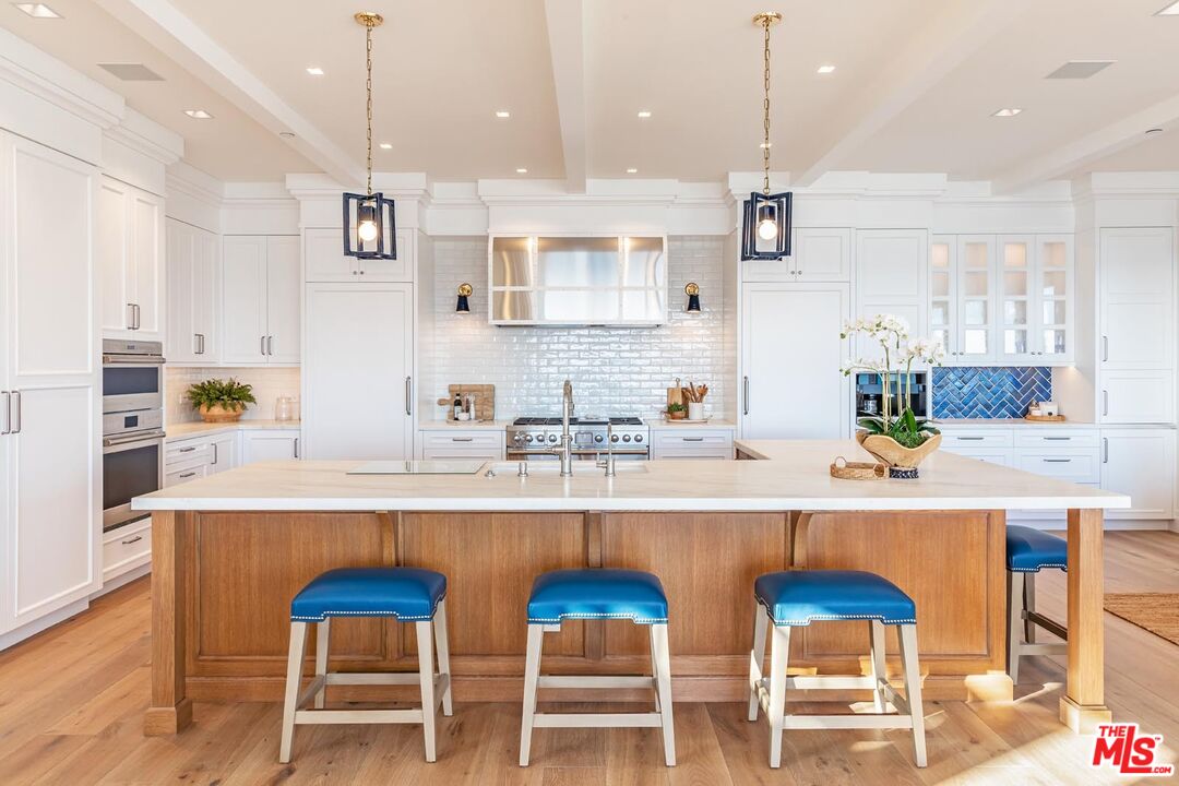 31412 Broad Beach Road Malibu, CA 90265 - Photo 8 of 32 a kitchen with a sink and chairs