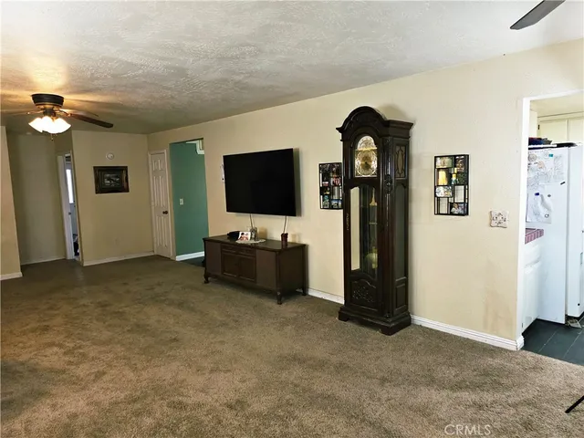a view of a workspace with furniture and a potted plant