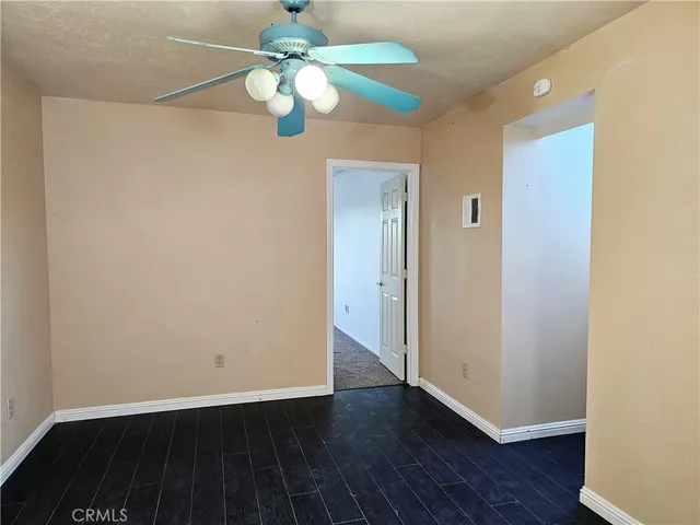 wooden floor in an empty room with a mirror
