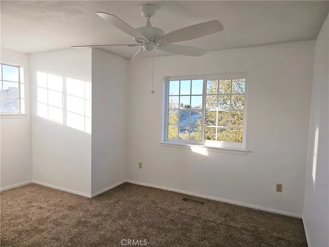 a bathroom with a sink mirror and a toilet