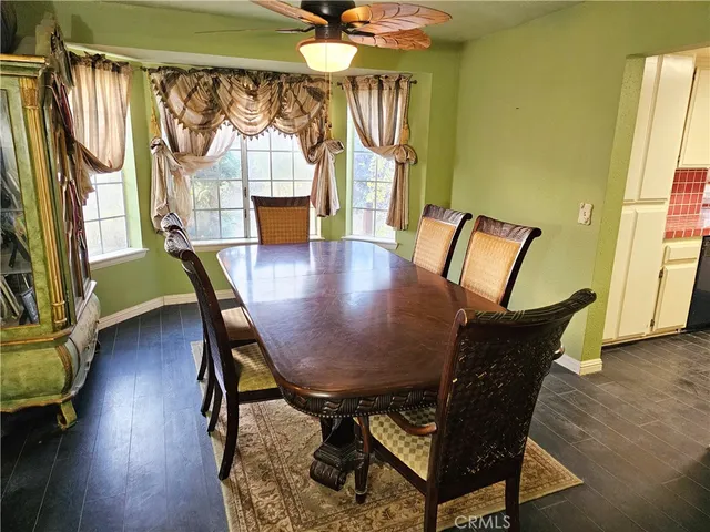 a kitchen with a stove sink and cabinets