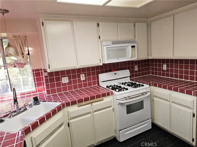 a room with pool table and a window