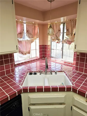 a kitchen with a stove and a sink
