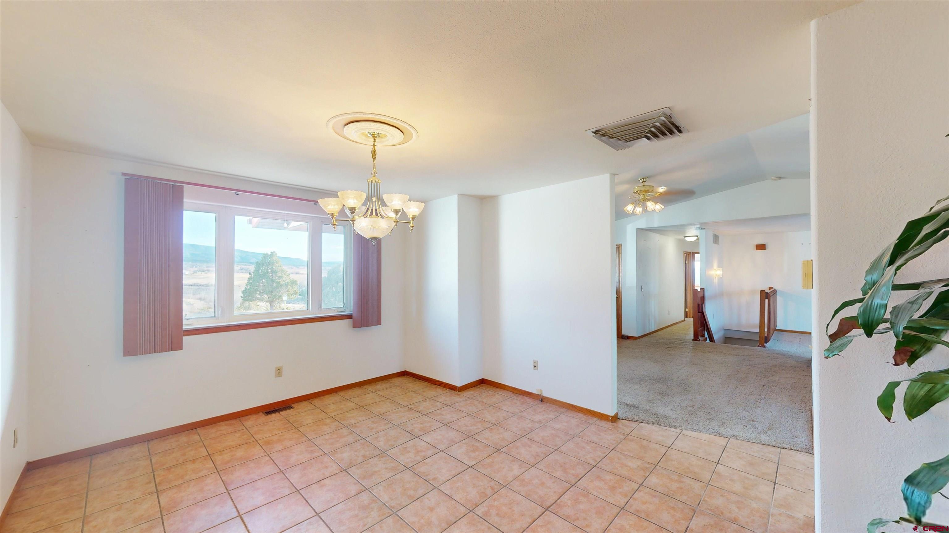 39865 Nelson Road Paonia, CO 81428 - Photo 23 of 38 a view of a livingroom with a chandelier fan and windows
