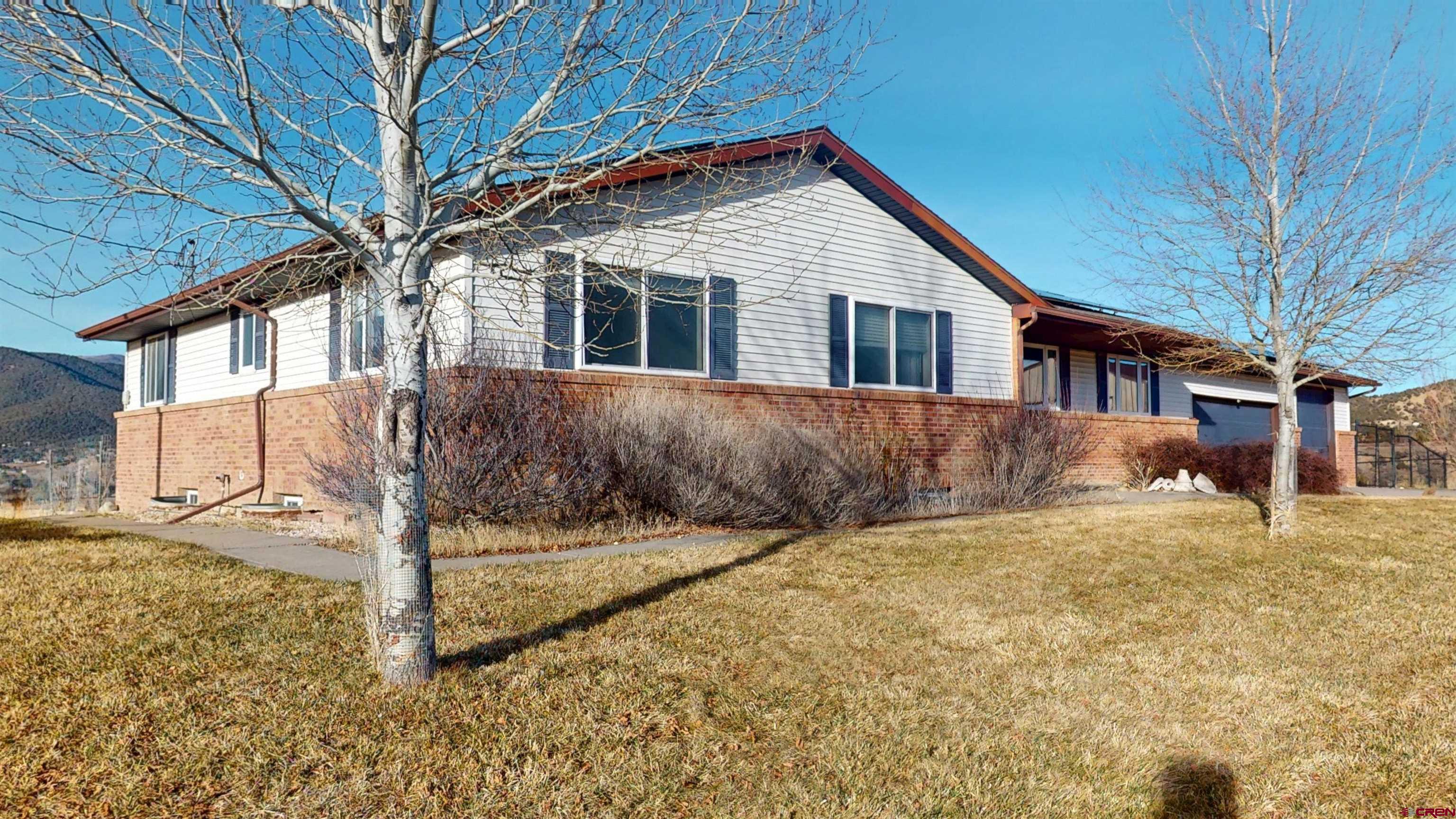 39865 Nelson Road Paonia, CO 81428 - Photo 4 of 38 a front view of a house with a yard