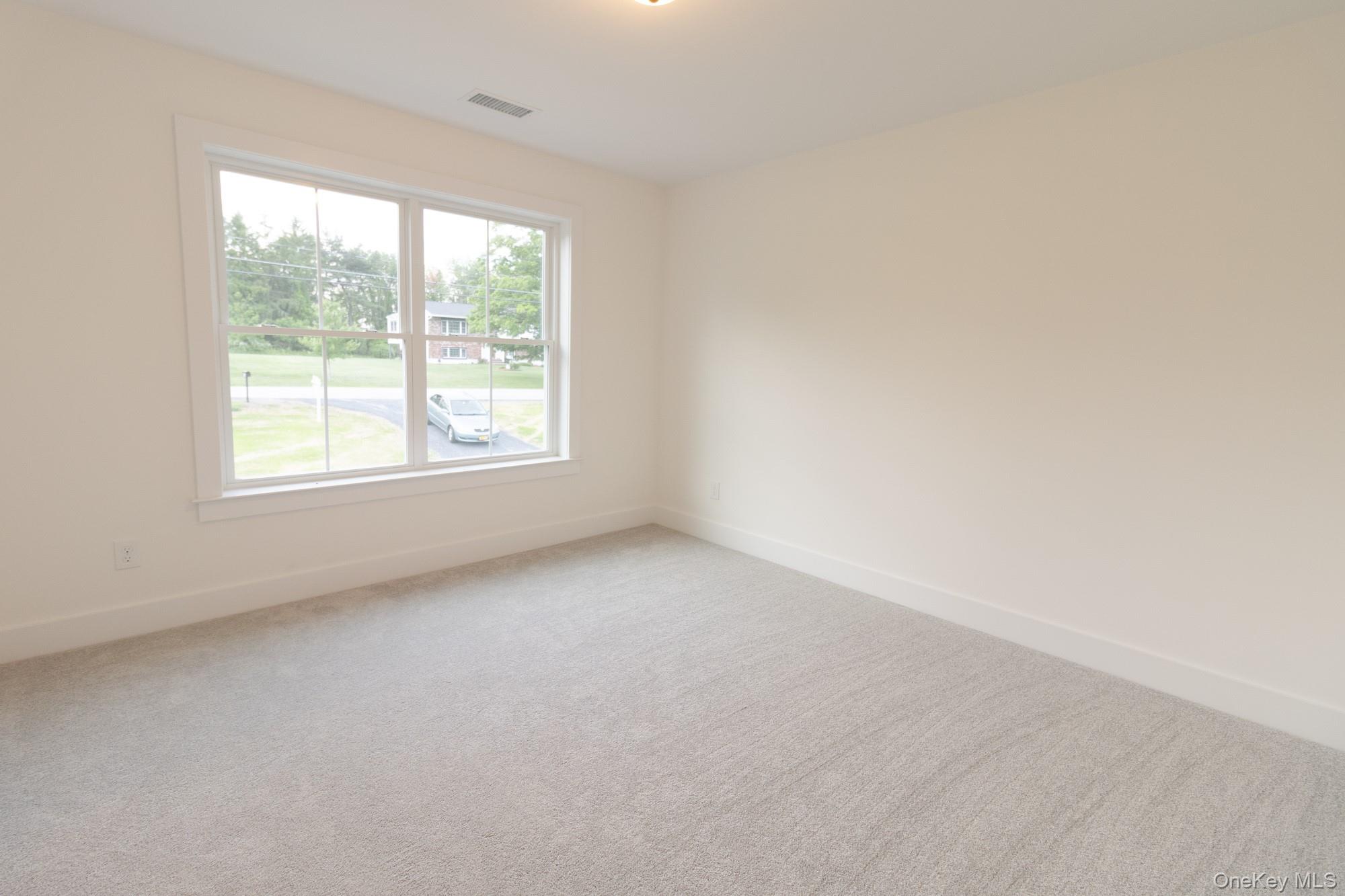 750 Ridgebury Road Slate Hill, NY 10973 - Photo 30 of 41 an empty room with a window