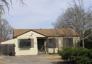 4119 South Hughes Street Amarillo, TX 79110 - Photo 1 of 1 a front view of a house with a glass door
