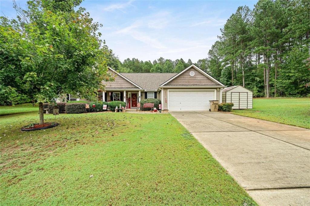 814 Alexis Way Winder, GA 30680 - Photo 1 of 1 a front view of a house with garden