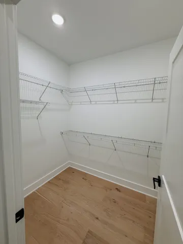 a view of a room with racks on the wall