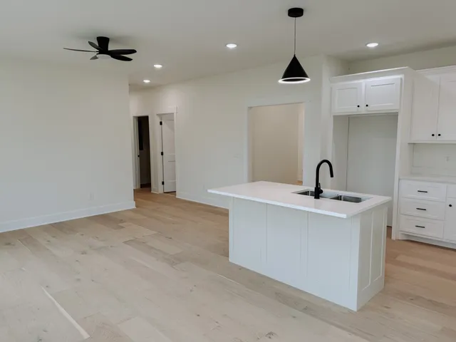 a view of an empty room with a sink