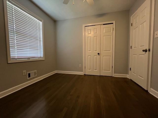 6935 Fielder Road Rex, GA 30273 - Photo 19 of 22 a view of an empty room with wooden floor and a window