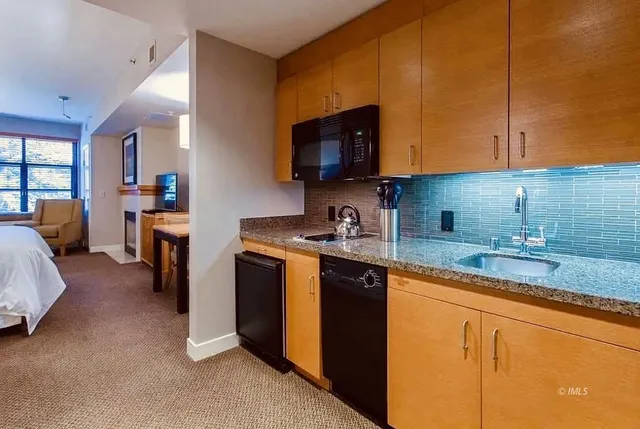 a bathroom with a toilet a sink and bathtub