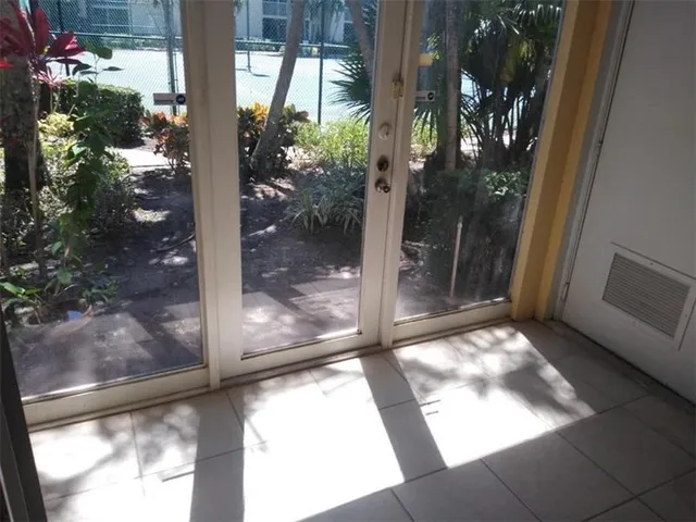 a view of backyard from a hallway