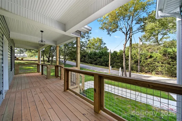 a view of a porch with wooden floor