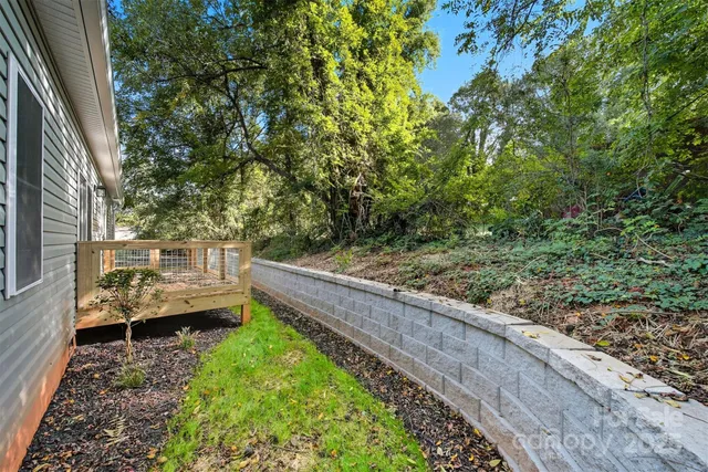 a view of a deck with couches and wooden fence