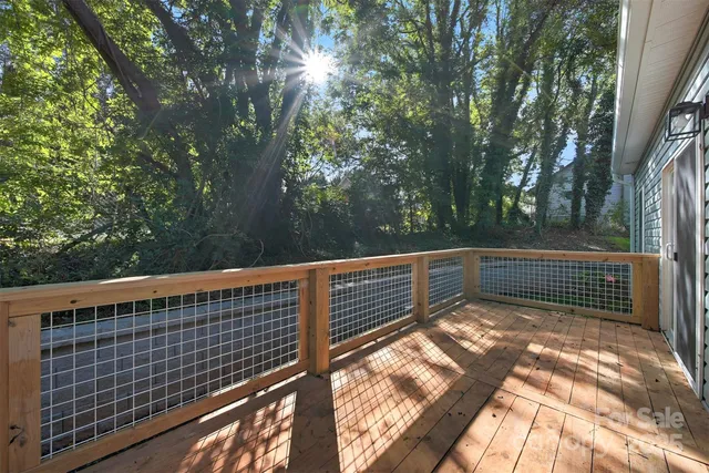 a view of balcony with two trees