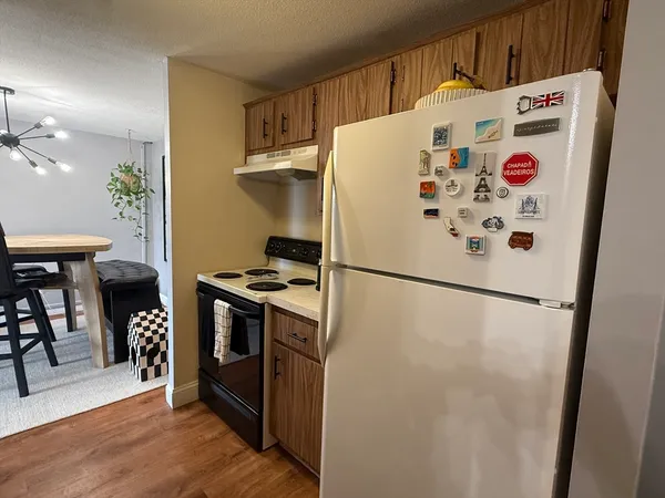 a white refrigerator freezer sitting inside of a kitchen