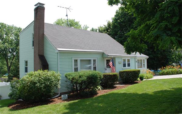 a front view of house with yard and green space