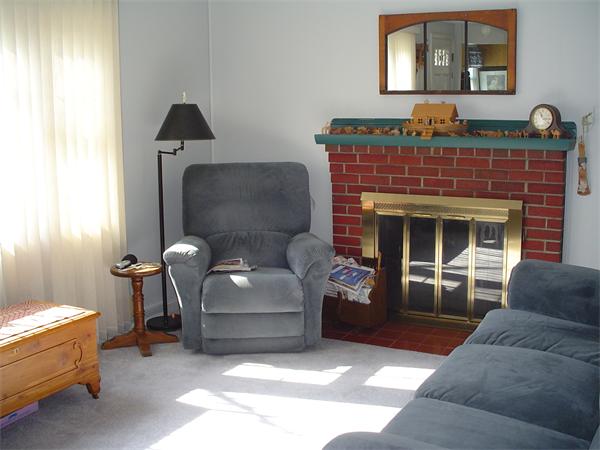195 North Road Chelmsford, MA 01824 - Photo 2 of 17 a living room with furniture and a fireplace