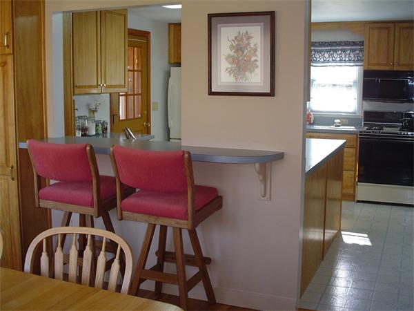 195 North Road Chelmsford, MA 01824 - Photo 4 of 17 a view of a dining room with furniture and a window