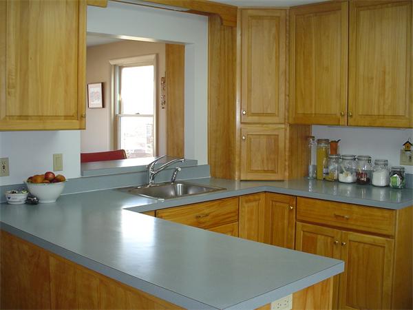 195 North Road Chelmsford, MA 01824 - Photo 6 of 17 a kitchen with stainless steel appliances a sink a counter and cabinets