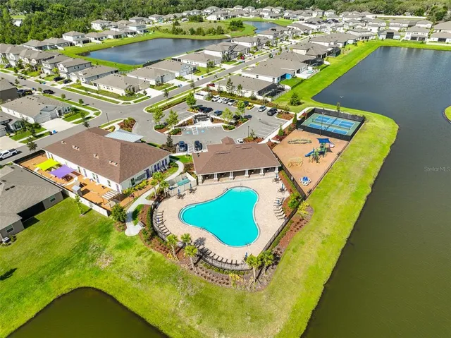 an aerial view of a house with a swimming pool