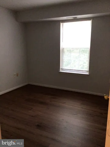 a sign that is sitting on the grass and the front of it