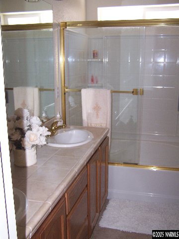 2345 Keystone Avenue Reno, NV 89503 - Photo 8 of 9 a bathroom with a sink and a mirror