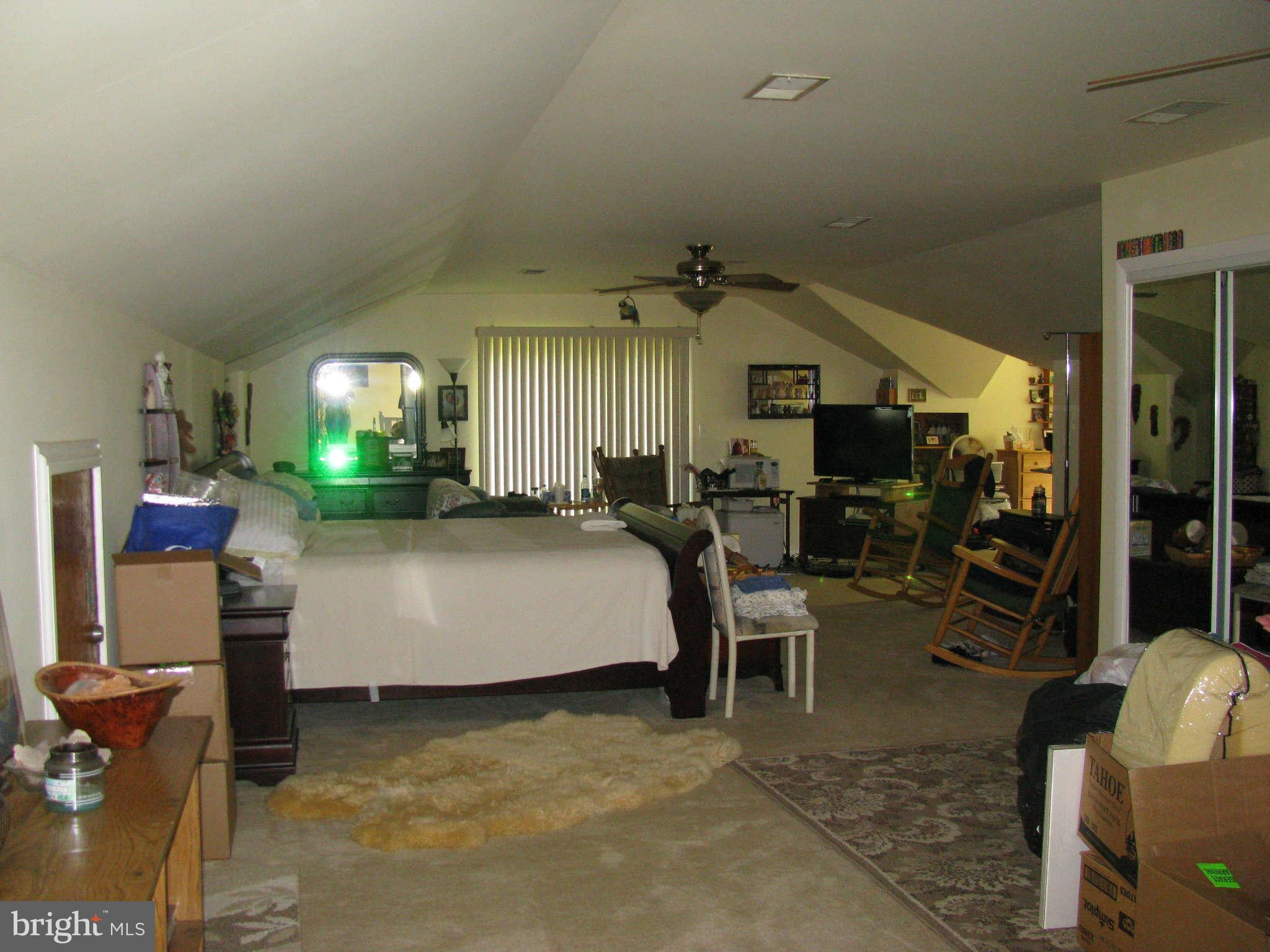 10337 Fairview Road Bumpass, VA 23024 - Photo 10 of 18 a living room with furniture and a flat screen tv