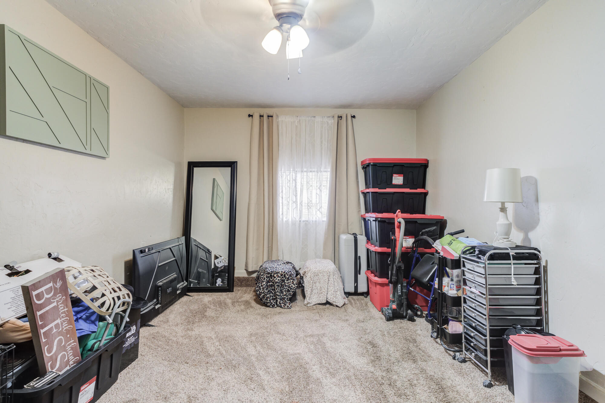 1515 36th Street Lubbock, TX 79412 - Photo 19 of 23 a bed room with a bed and a desk