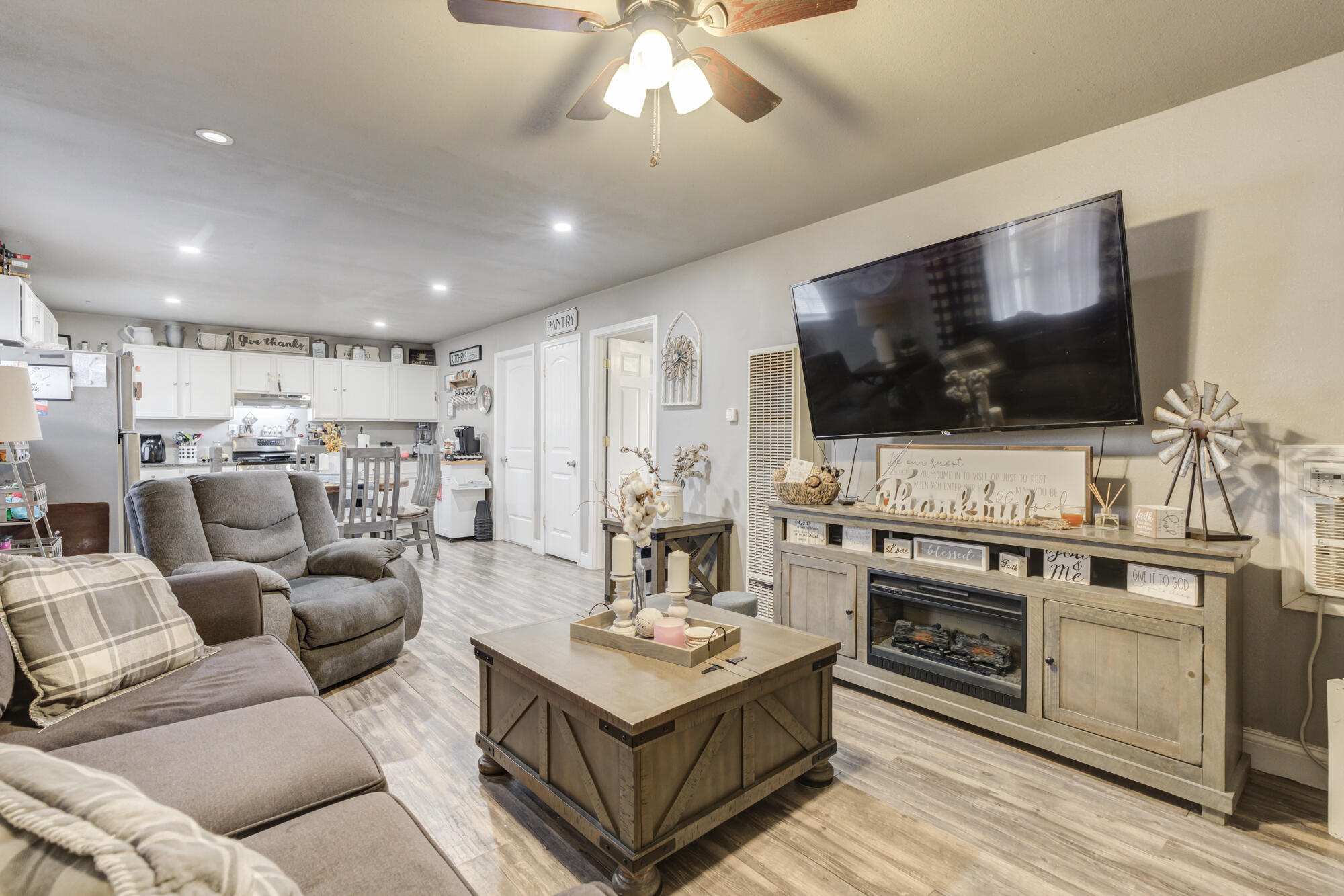 1515 36th Street Lubbock, TX 79412 - Photo 2 of 23 a living room with furniture and a flat screen tv
