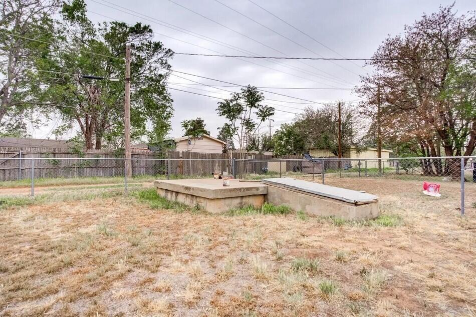 1515 36th Street Lubbock, TX 79412 - Photo 21 of 23 a view of a swimming pool with a yard and sitting area