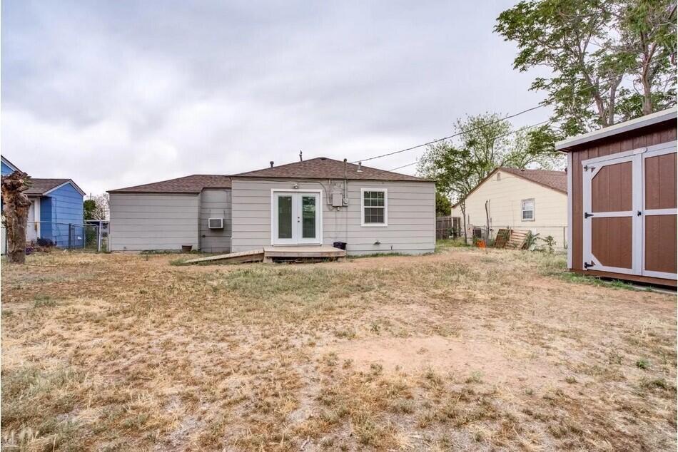 1515 36th Street Lubbock, TX 79412 - Photo 22 of 23 a view of a house with a backyard