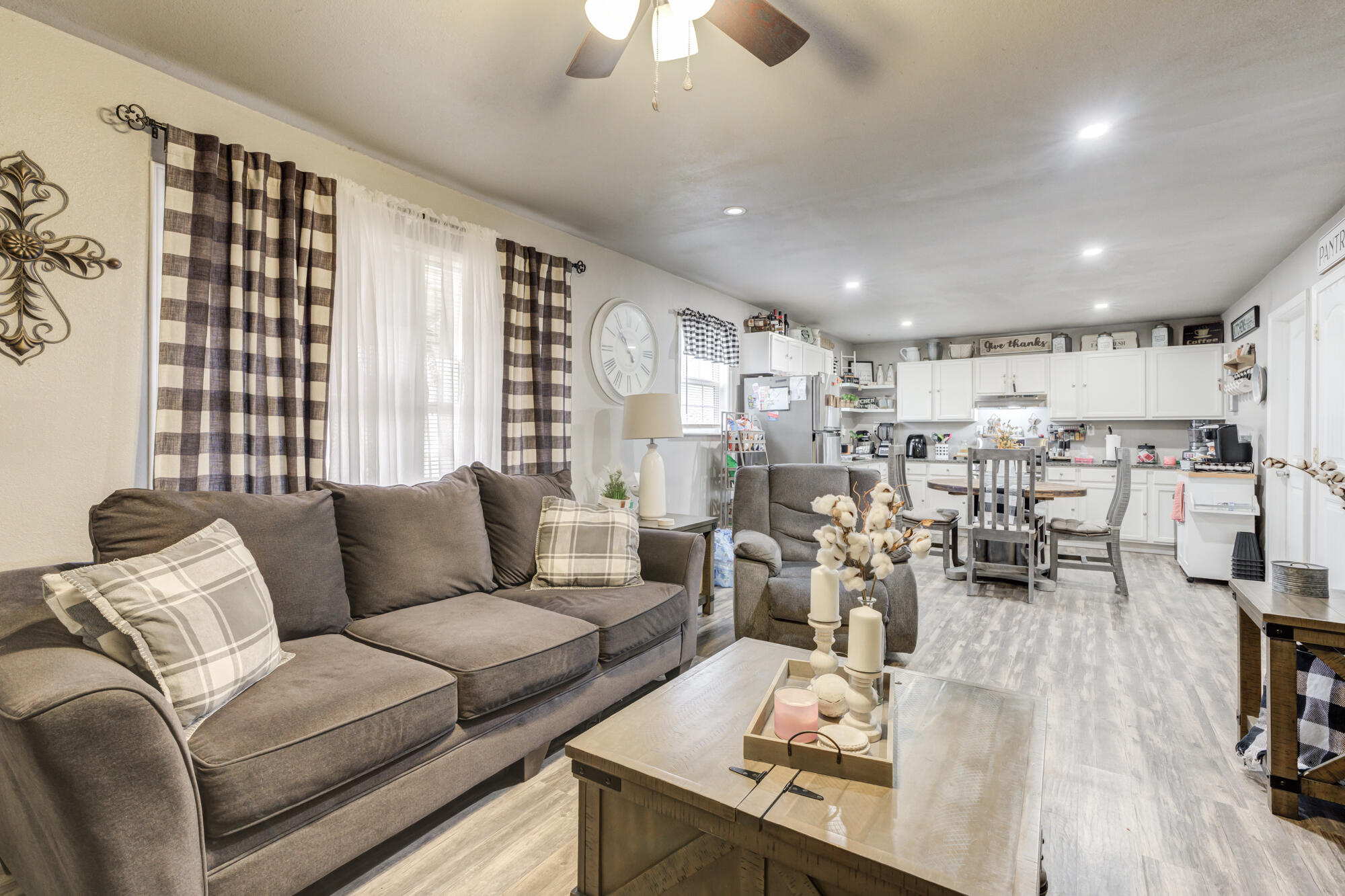 1515 36th Street Lubbock, TX 79412 - Photo 4 of 23 a living room with furniture and a large window