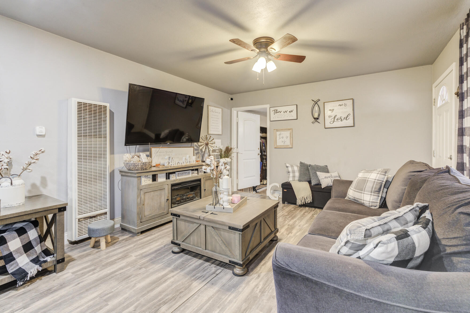 1515 36th Street Lubbock, TX 79412 - Photo 6 of 23 a living room with furniture and a flat screen tv