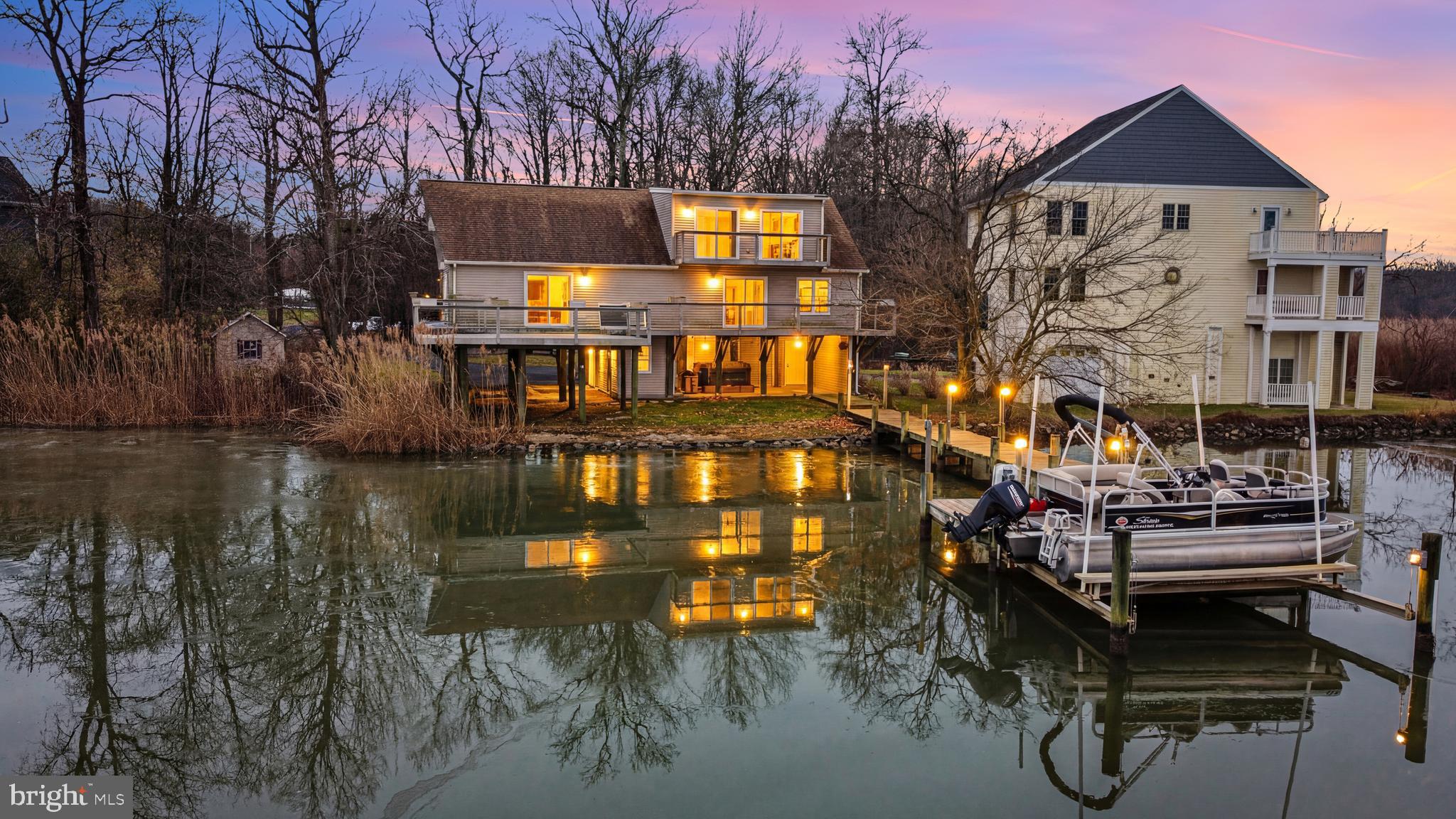 a view of swimming pool with outdoor seating and city view
