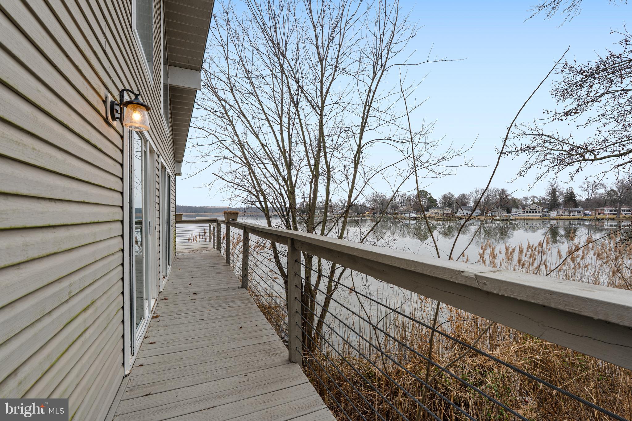 6812 Schaadts Road, Unit 6812 Middle River, MD 21220 - Photo 12 of 54 a view of balcony with wooden floor and fence and floor