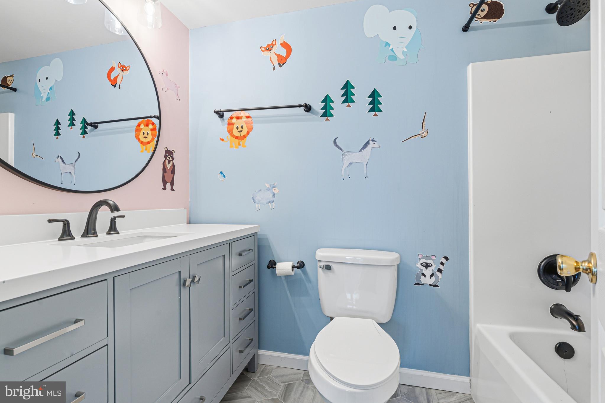 6812 Schaadts Road, Unit 6812 Middle River, MD 21220 - Photo 25 of 54 a bathroom with a sink a toilet and a mirror