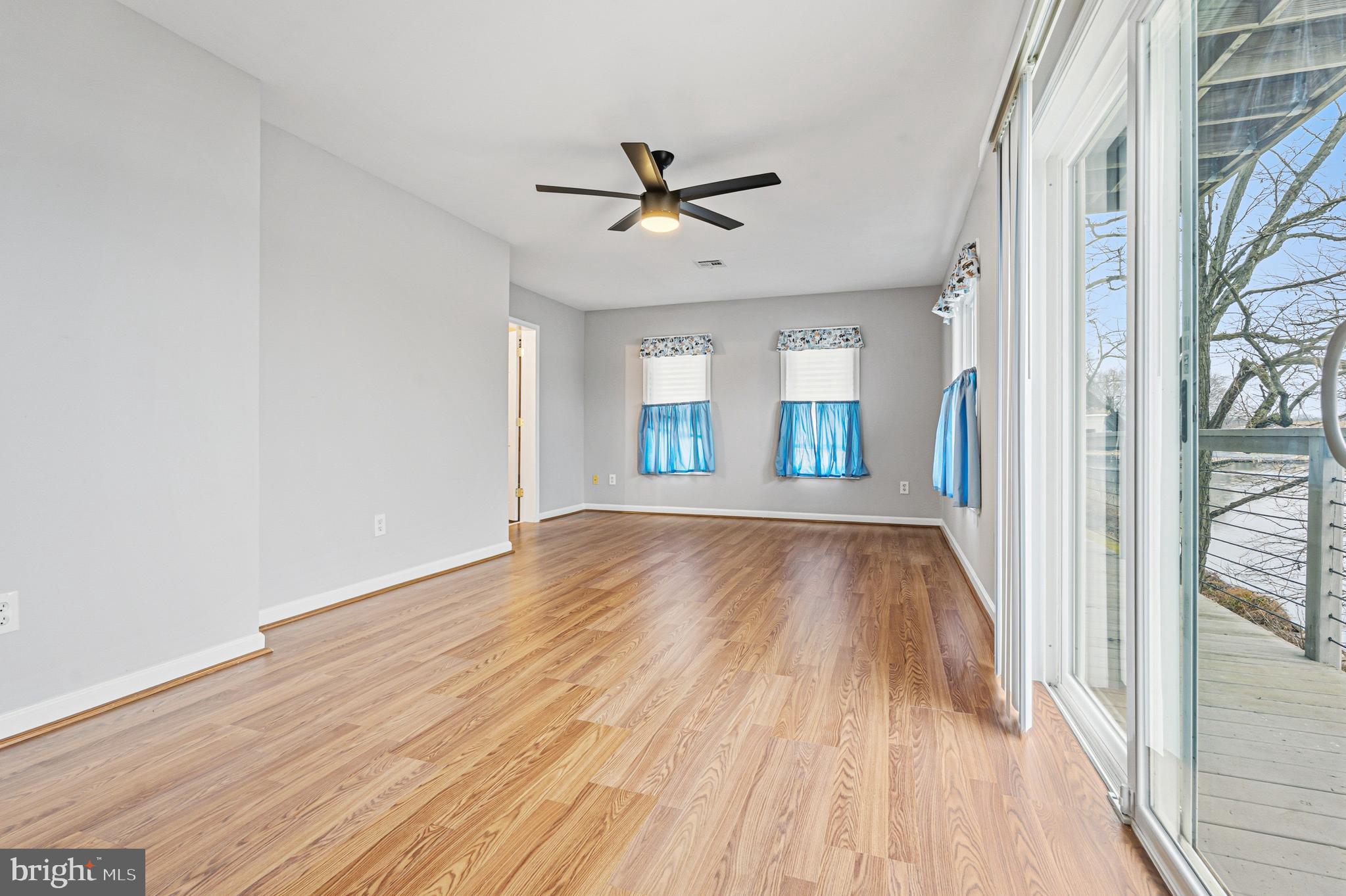 6812 Schaadts Road, Unit 6812 Middle River, MD 21220 - Photo 26 of 54 wooden floor in an empty room with a window