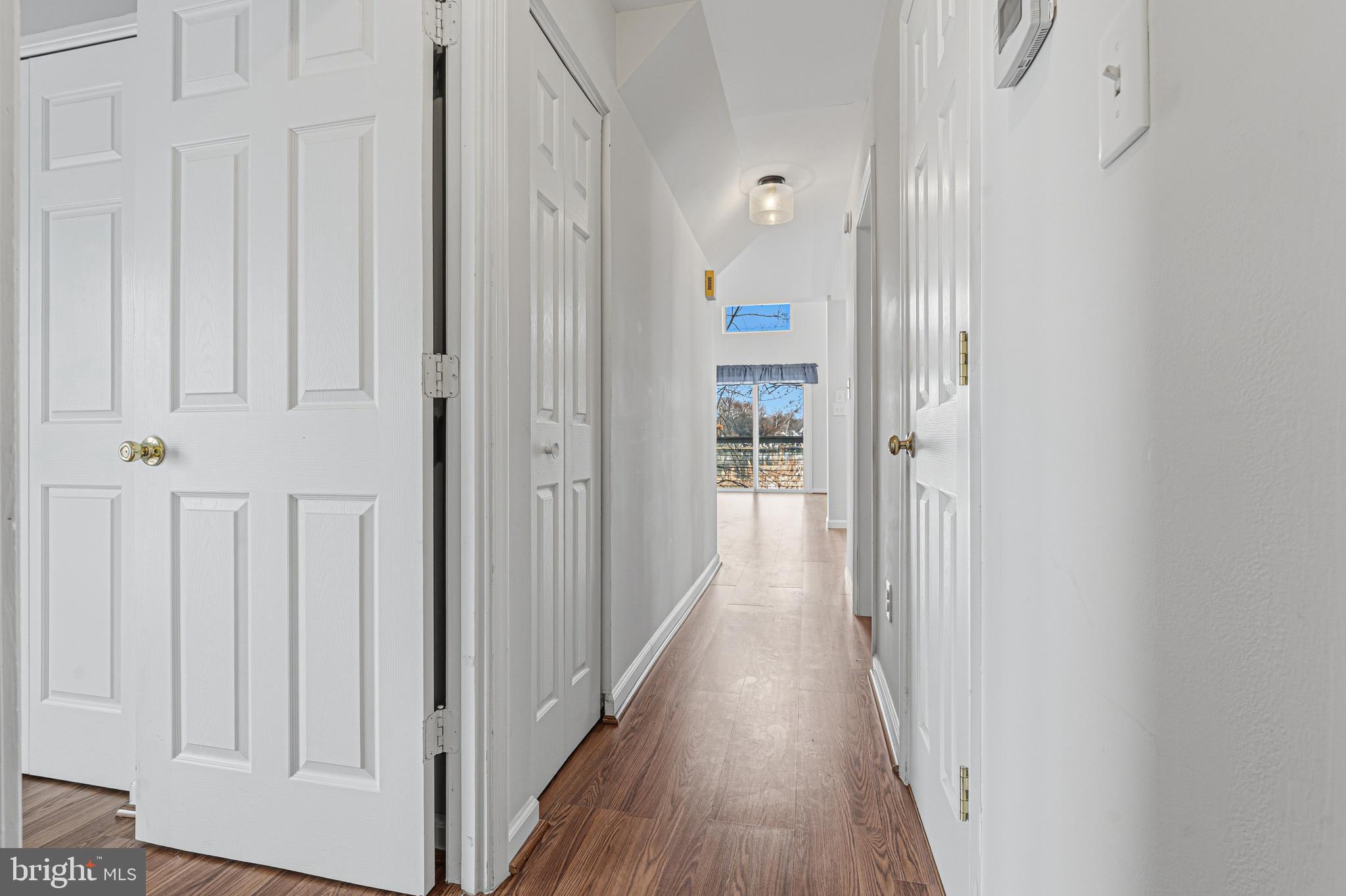 6812 Schaadts Road, Unit 6812 Middle River, MD 21220 - Photo 28 of 54 a view of a hallway with wooden floor