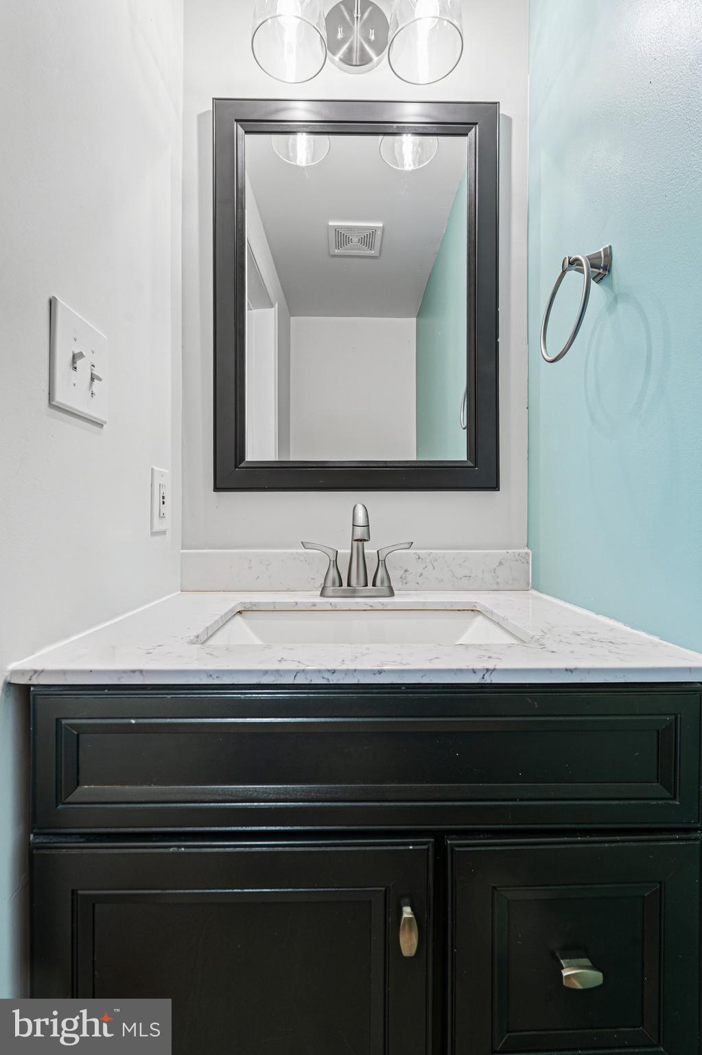 6812 Schaadts Road, Unit 6812 Middle River, MD 21220 - Photo 33 of 54 a bathroom with a sink and a mirror