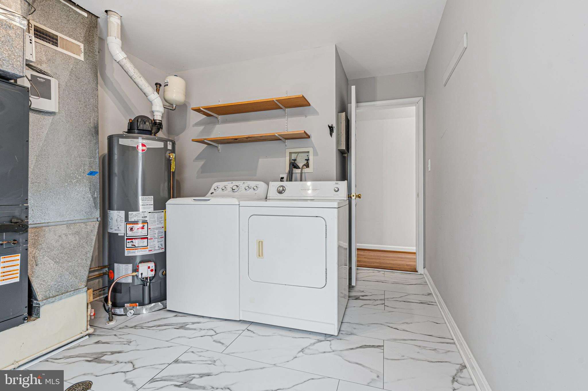 6812 Schaadts Road, Unit 6812 Middle River, MD 21220 - Photo 36 of 54 a utility room with dryer and washer