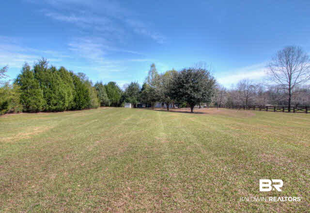 23220 T D Barnett Road Robertsdale, AL 36567 - Photo 3 of 24 front yard