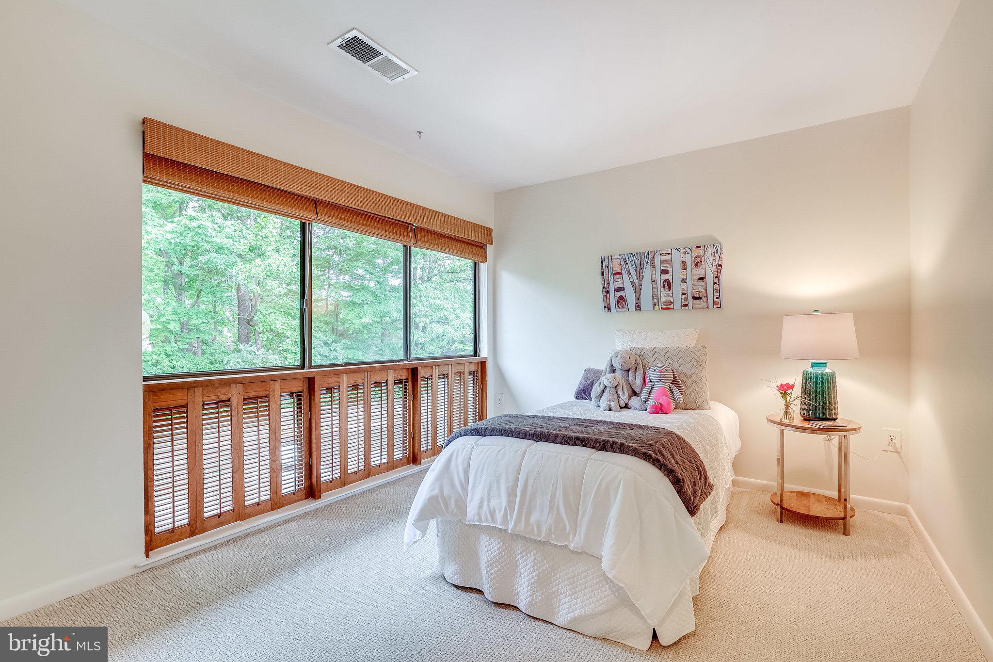 2024 Lakebreeze Way Reston, VA 20191 - Photo 53 of 95 a bedroom with a bed and a large window