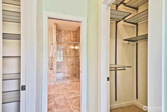 a view of a bathroom with a glass door