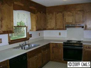 12616 Newstead Road Huntersville, NC 28078 - Photo 3 of 8 a kitchen with a sink and cabinets